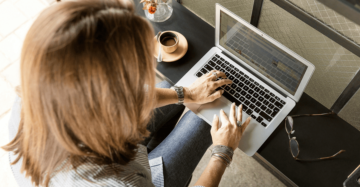 Woman Typing in B2B eCommerce Portal on Laptop